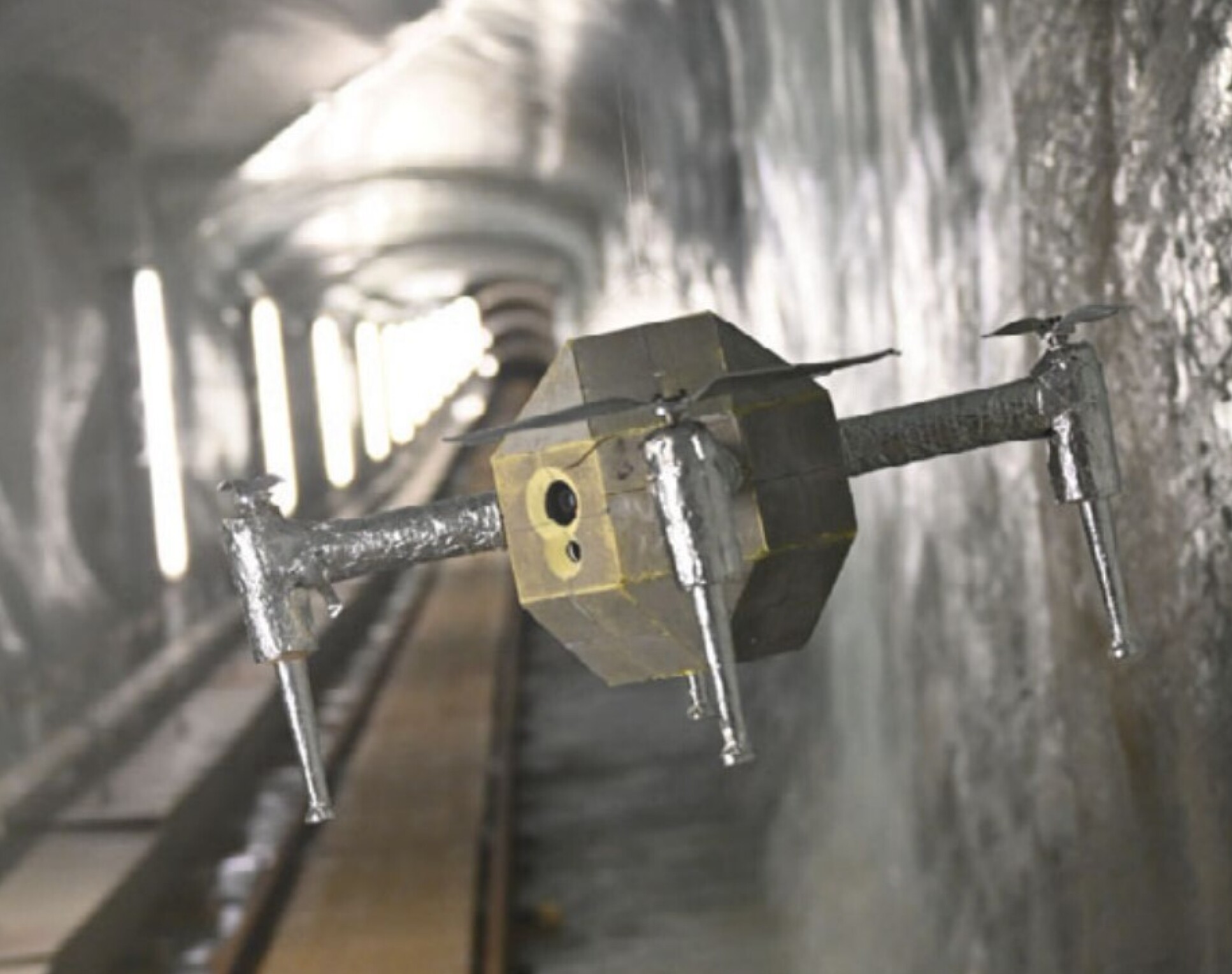 A drone in an artificial tunnel inside a glacier