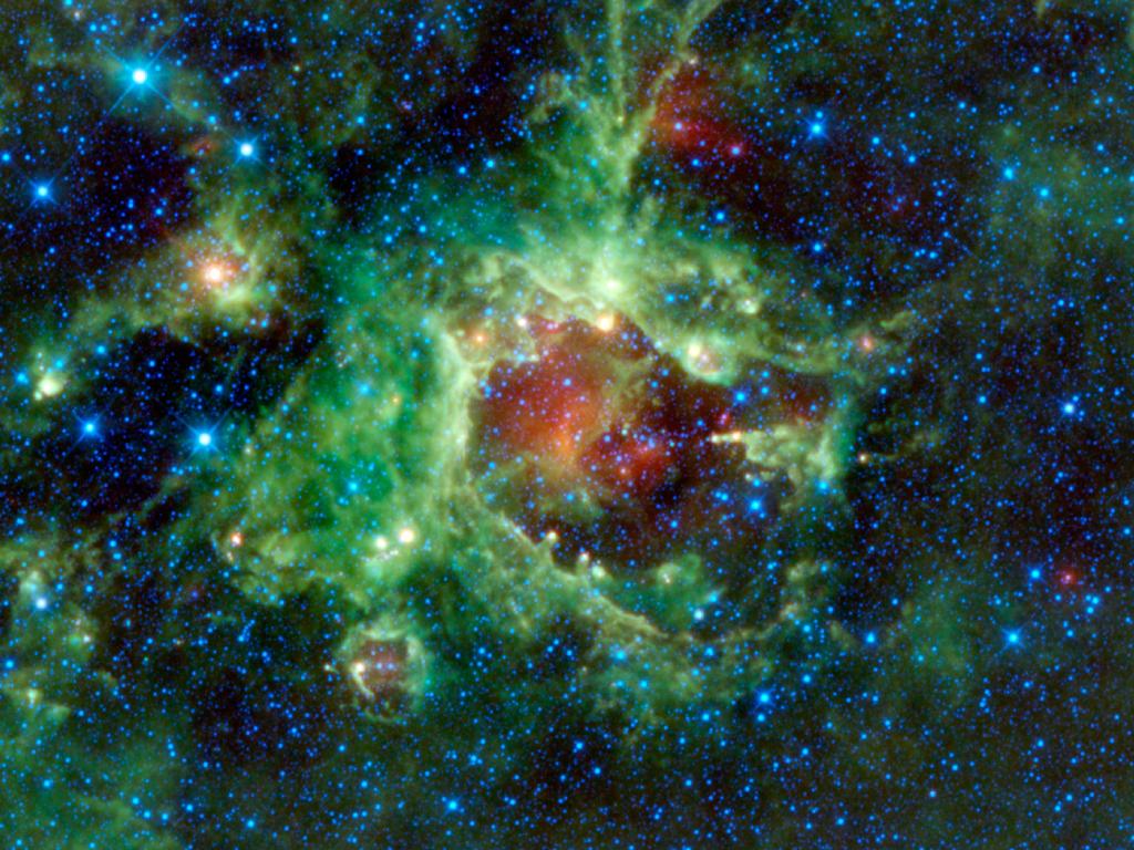 NASA's WISE (Wide-field Infrared Survey Explorer) captured this infrared image of Sh2-284.  This clearly shows how the stars in Dolidze-25 carve out a bubble in the center of the HII region.  Image Credit: NASA/JPL-Caltech/UCLA 