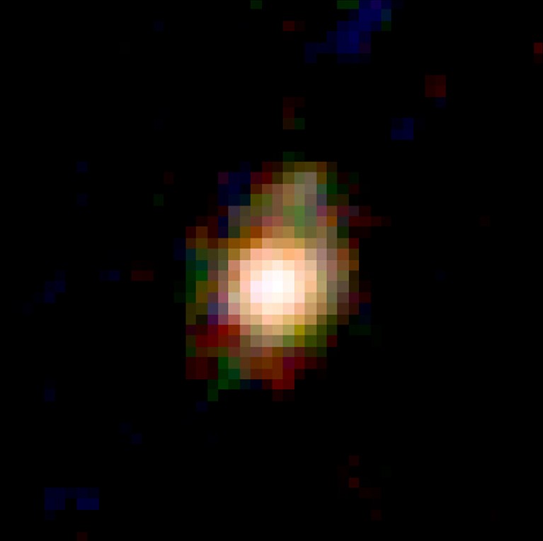 A red-green-blue (F444W-F410M-F277W) image of the galaxy, showing the central core and disc.